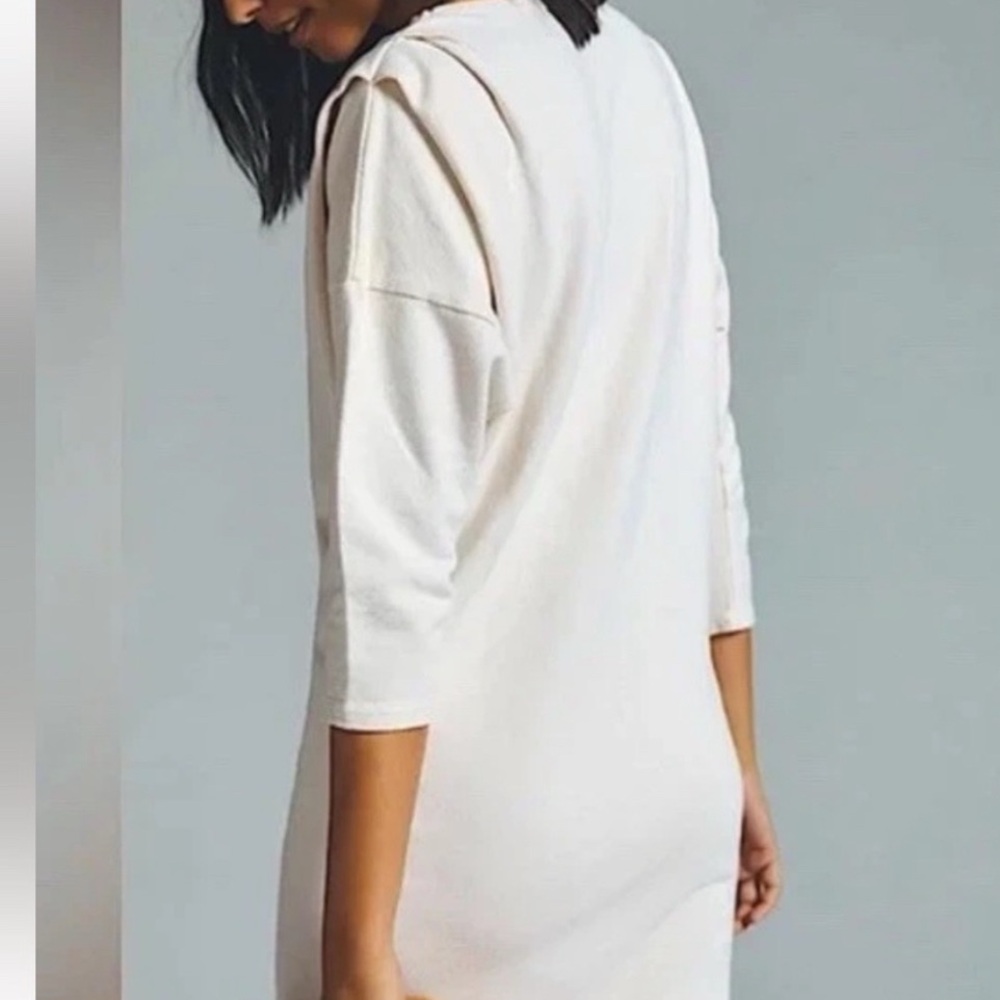 Made in USA, never worn, new with tags T.La mini dress with ruched shoulders.